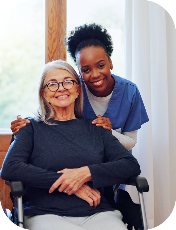 A nurse and an elderly woman smiling