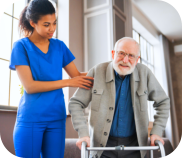 A nurse assisting an elderly man