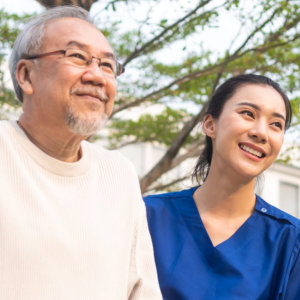 An elderly man and a woman smiling